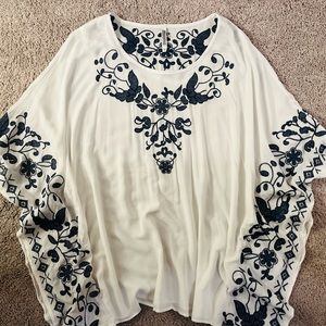 Gorgeous white with navy embroidery. Size L Monoreno blouse. Never worn